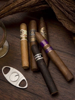 five cigars with cutter